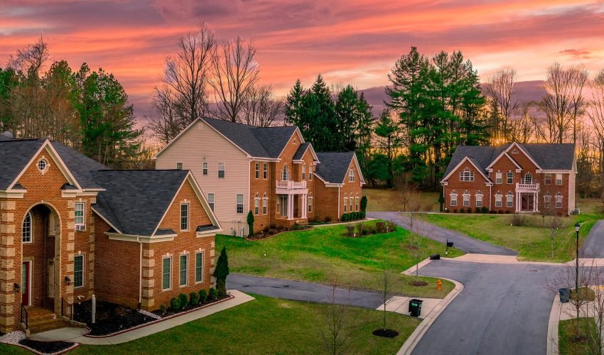 Neighborhood street sunset panorama of modern upper middle class